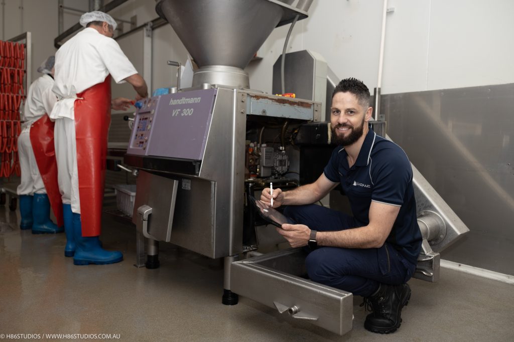 A VACPAC technician inspecting a piece of equipment.