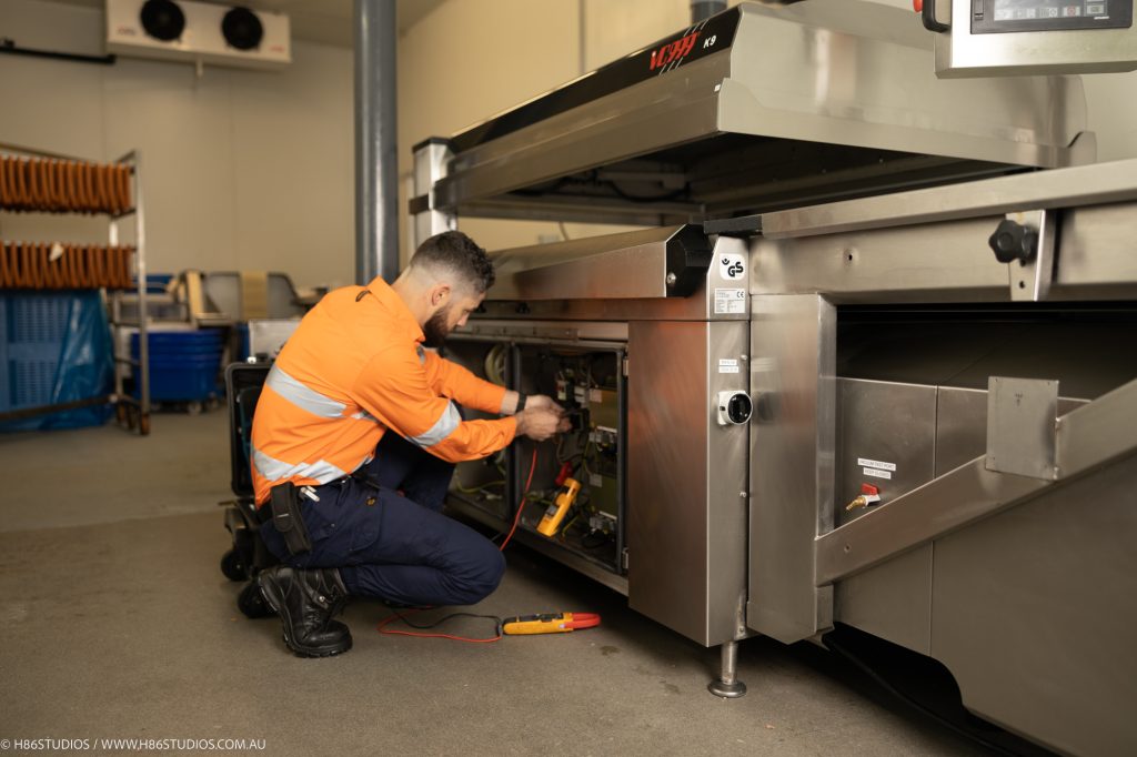 A VACPAC technician servicing a VC999 machine. 